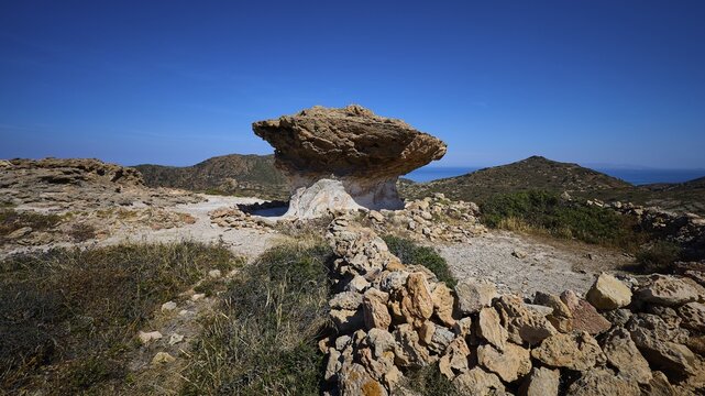 Rocky path leads through hilly landscape with distinctive rocks, mushroom rocks, mushroom rock, bizarre rocks, rock formation, Skiadi, Kimolos, Cyclades, Greek Islands, Greece
