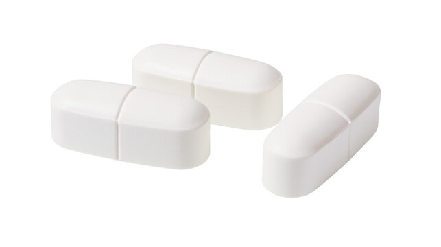 Three white oblong pills with score line