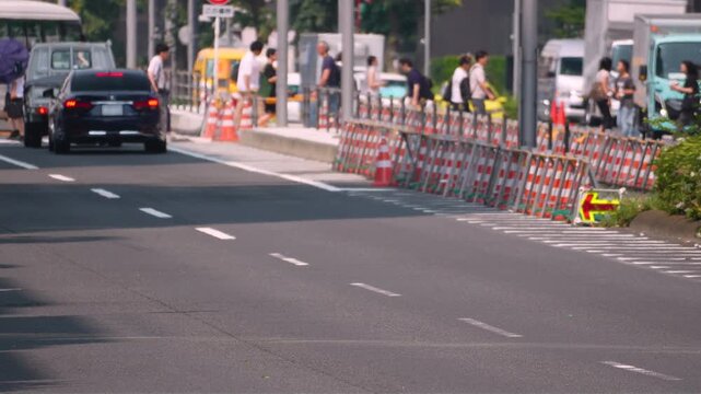 [Weather Phenomena]Extreme Summer Heatwave with Shimmering Air Distortion Over Asphalt Road, Pedestrians Crossing at a Crosswalk. Tokyo during a heatwave.