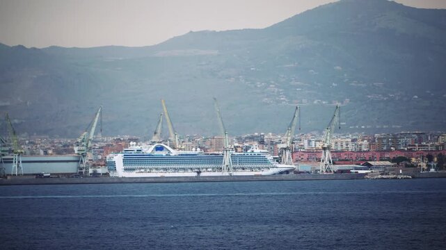 Anchored Cruise Ship in Palermo Port with City and Mountain Backdrop