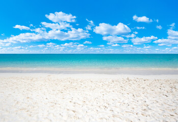 Beach and beautiful tropical sea. Blue sky and white clouds. © Pakhnyushchyy