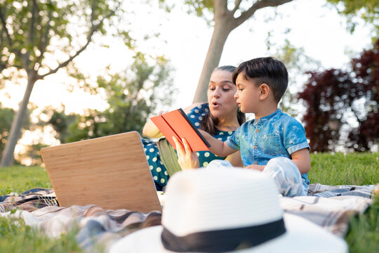 Woman telling story to grandson at park