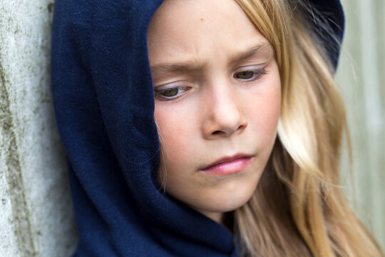 Portrait of unhappy blond girl