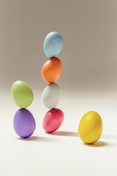 Colorful spotted Easter egg stack balancing in still life