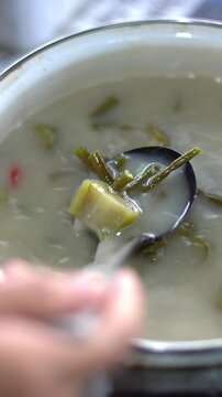 Vertical Close Up of Stirring Sayur Lodeh, Traditional Indonesian Vegan Coconut Milk Vegetable Stew