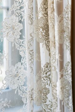 Closeup of intricate lace curtain texture with floral patterns, illuminated by soft morning light filtering through the window