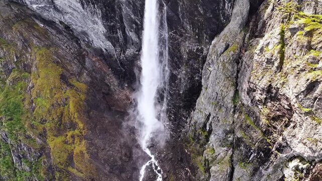 This waterfall descends from towering cliffs, where glacial meltwater creates one of Europe's highest free falling cascades. Mardalsfossen, More og Romsdal, Norway.