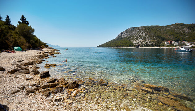 rocky beach with clear water, croatia