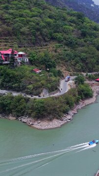 Vertical Aerial View of Bikers Riding Along Chamera Lake Road, Himachal Pradesh