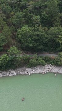 Vertical Aerial View of Bikers Riding Along Chamera Lake Road, Himachal Pradesh