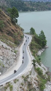 Vertical Aerial View of Bikers Riding Along Chamera Lake Road, Himachal Pradesh