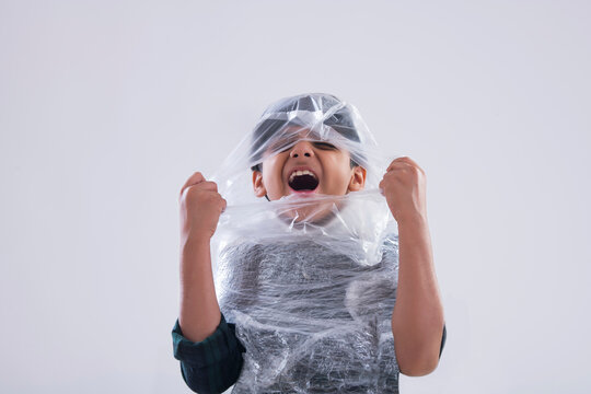 Young boy wrapped in plastic unable to breathe. (Children) 
