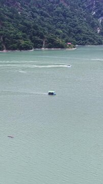 Vertical Aerial View of Chamera Lake with Speedboat, Himachal Pradesh, India