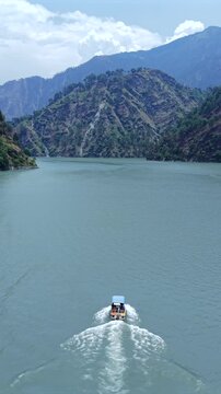 Vertical Aerial View of Chamera Lake with Speedboat, Himachal Pradesh, India
