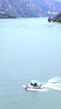Vertical Aerial View of Chamera Lake with Speedboat, Himachal Pradesh, India