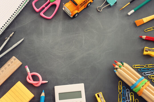 Back to school concept over classroom blackboard. Top view