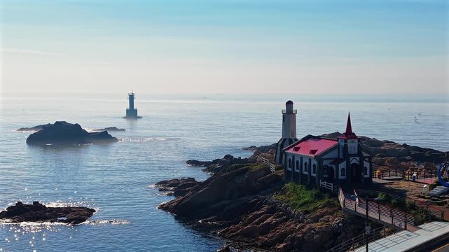 4K aerial footage of Jukseong Catholic Church on a rocky cliff in Gijang, Busan