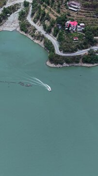Vertical Aerial View of Chamera Lake with Speedboat, Himachal Pradesh, India