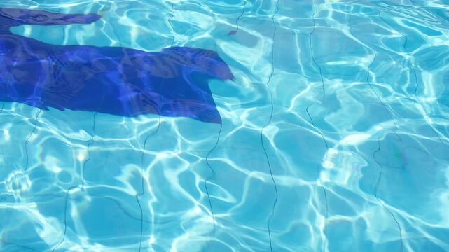 Clear water ripples beneath bright sunlight.