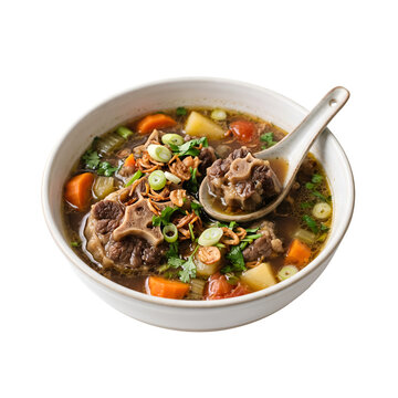 Delicious Indonesian Oxtail Soup or Sop Buntut with Beef and Vegetables in a White Bowl on Black Background