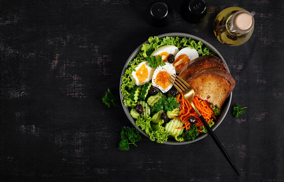 Nutritious Breakfast Plate with Fresh Salad and Whole Grain Bread. Top view, overhead