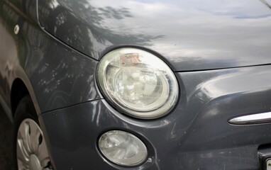 Close-up photo of vintage automobile car light front side retro style picture  © Elena K