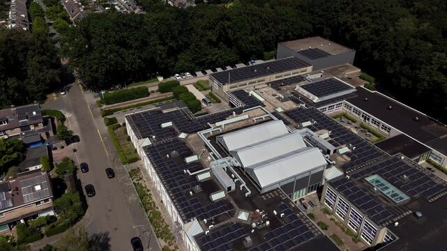 Aerial Drone View of RSG Slingerbos School Campus in Harderwijk During Summer Vacation crane down with neighborhood