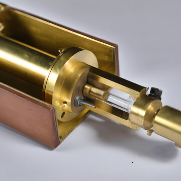 Vintage brass scientific instrument macro on clean background