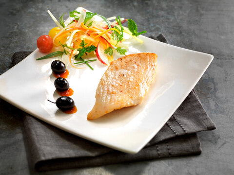 Grilled Salmon Fillet Steak Served with Fresh Vegetables Salad on White Square Plate Grey Napkin Dark Concrete 