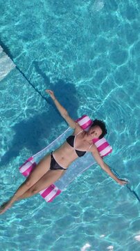 Aerial View Woman Floating in Luxury Villa Pool Chalkidiki Greece