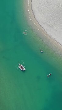 Aerial view of boat and people swimming at Glarokavos Beach Halkidiki