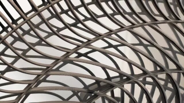Abstract Close Up Of A Curved Plastic Fan Guard Grill Pattern