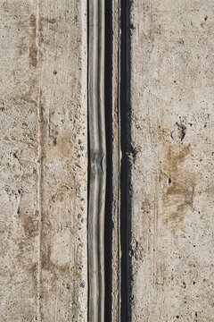 Concrete expansion joint with rubber seal on pavement