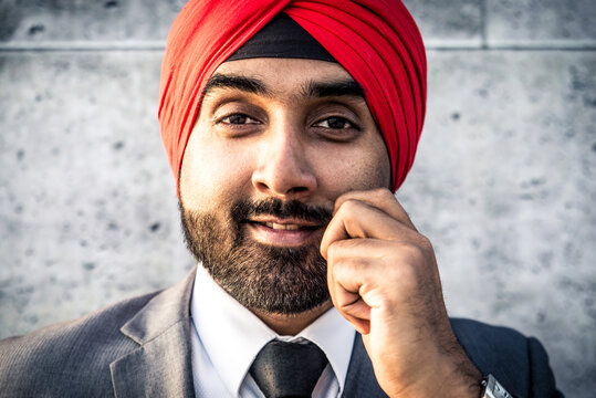 Punjab businessman wearing traditional indian head scarf and formal corporate business suit