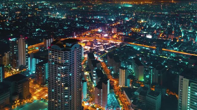 Osaka City Skyline Night Timelapse Aerial View Featuring Glowing Highway Traffic and Dense Urban Architecture in a Vibrant Japanese Metropolis Captured in 4k Resolution