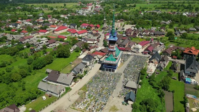 Aerial drone view of the Merry Cemetery, a famous open air museum in Sapanta, Romania, known for its colorful tombstones with carvings