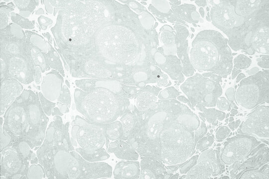 Abstract grey marbled paper texture background featuring organic fluid patterns and stone design, ideal for luxury stationery, modern interior decor, and elegant wrapping paper.