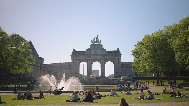 Brussels Triumphal Arch in Parc du Cinquantenaire Belgium crowded park