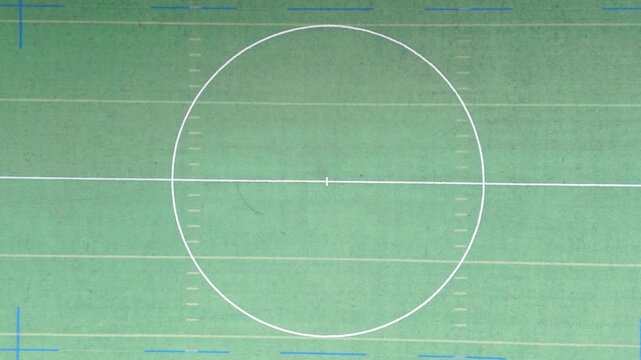 Top down aerial view of multi sport turf field inside stadium