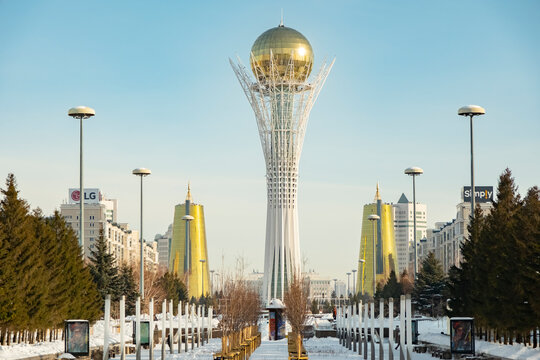 View of the Bayterek Tower in Nur-Sultan during winter with clear sky and surrounding buildings. January 30, 2026. Astana, Kazakhstan