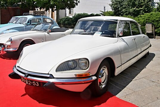 White Citro&euml;n DS classic car display on red carpet