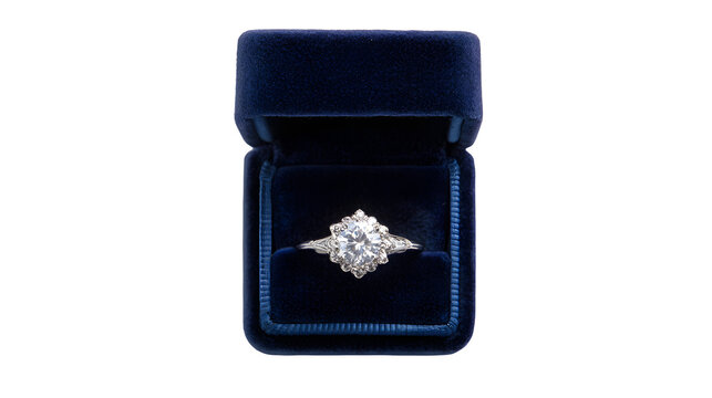 Diamond ring in open dark blue velvet jewelry box top view with box white background engagement accessory gemstone proposal fashion wedding with silver