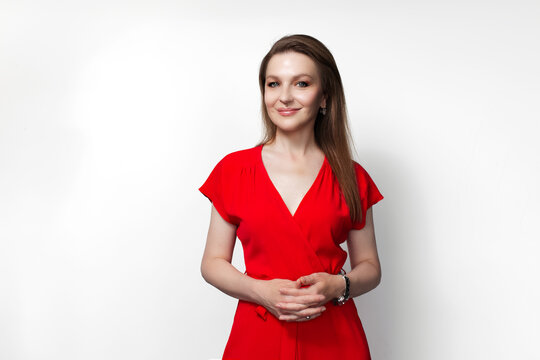 Young smiling girl in red dress. Isolated on white background.