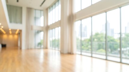 Fototapeta premium Out of focus modern office building interior with large windows and bright natural light for business corporate background and professional commercial real estate marketing