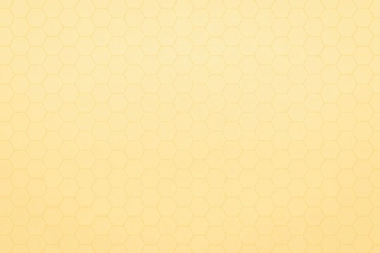 Honeycomb pattern on a yellow background, featuring hexagonal texture and geometric design elements.