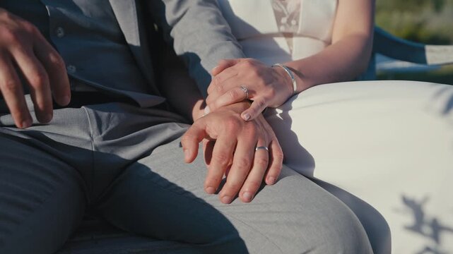 Close Up of Bride and Groom Hands Showing Wedding Rings