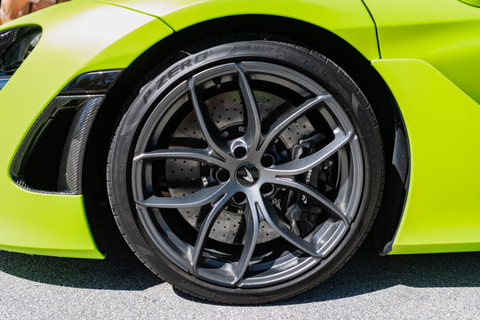 Miami, Florida, USA - July 27, 2025: Luxury sport car McLaren 720S. Car McLaren 720S parked outdoor. Green yellow supercar sportscar, wheel view. McLaren 720S 2021 supercar sports car.
