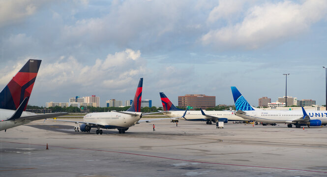 Chicago, Illinois, USA - June 12, 2025: Plane arrival of United and Delta airline. Departure and arrival at airport terminal. Airplane terminal. Travel by plane. Airport terminal. Aviation