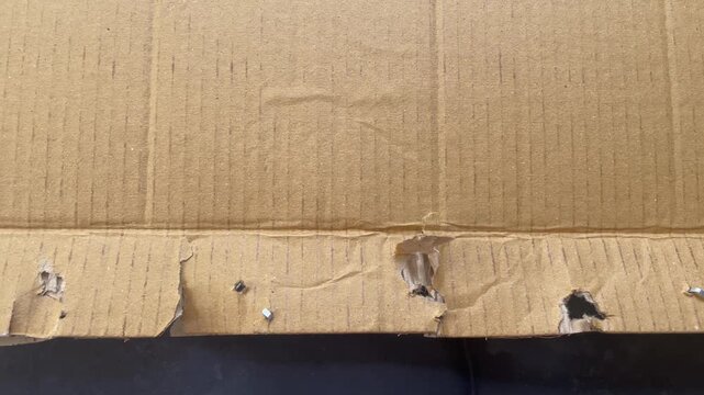 Torn Cardboard Texture with Staples and Rough Surface Background