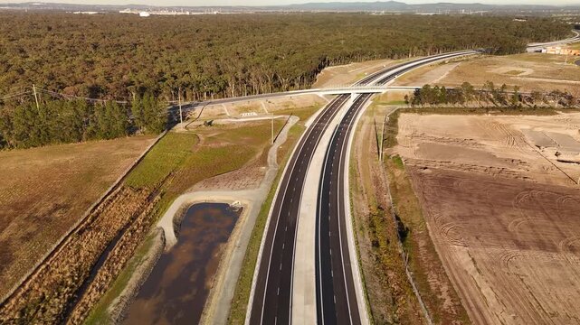 Aerial drone view of the M1 Pacific Motorway Extension project at Heatherbrae, Newcastle, NSW Australia heading south toward Masonite Road on 26 July 2026